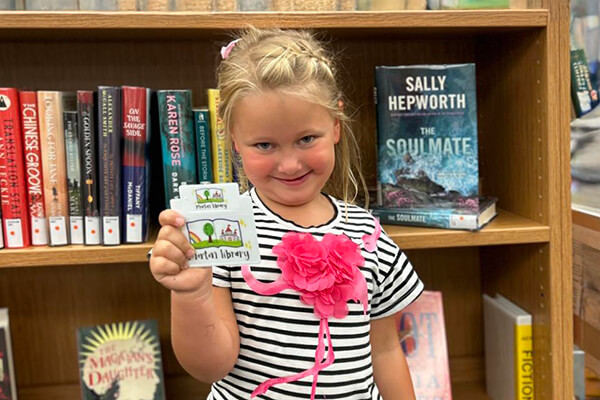 Girl with Library Card Photo